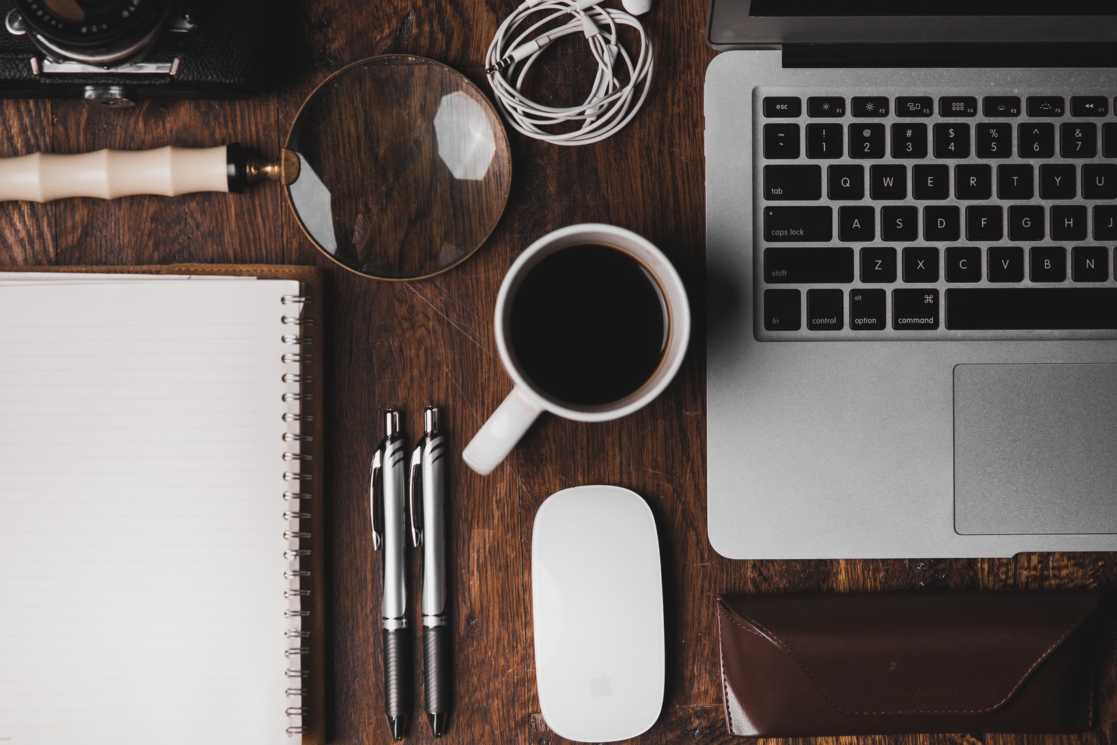 Foto von ian dooley cup of coffee near MacBook Pro